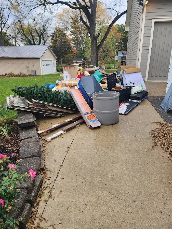 Dumpster being loaded with debris for 3 Yard Dumpster Rental in White Knoll